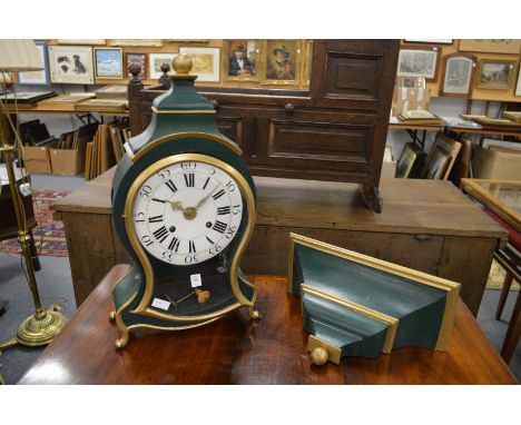 A 19th century Continental bracket clock with green and gilt painted decoration with matching bracket.