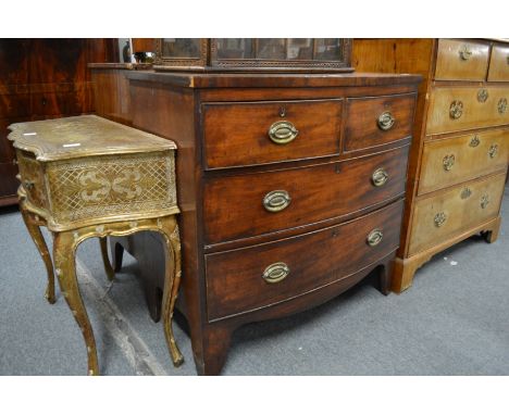 A 19th century mahogany bow front chest of two short and two long drawers on bracket feet.