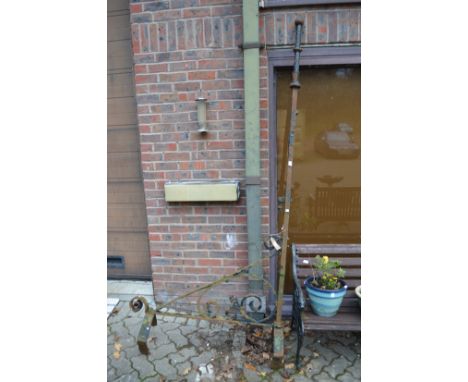 A large wrought iron sign bracket.