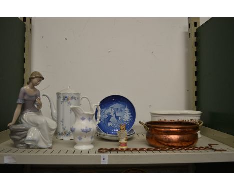 A Nao figurine and other decorative items.