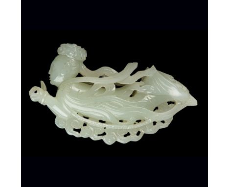 WHITE JADE CARVING OF AN APSARA QING DYNASTY, 18TH CENTURY carved in round with a flying deity apsara dressing in a long robe