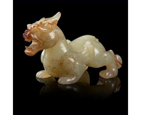 RARE PALE CELADON JADE CARVING OF A BIXIE WESTERN HAN DYNASTY the mythical beast carved in round, prowling with the right fro