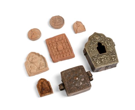 COLLECTION OF EIGHT TIBETAN ARTICLES QING DYNASTY, 19TH CENTURY comprising: a white metal covered brass portable shrine, Gau,