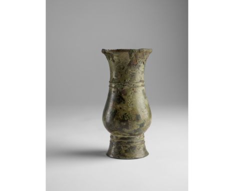 INSCRIBED ARCHAIC BRONZE RITUAL WINE VESSEL, ZHI LATE SHANG DYNASTY, 12TH-11TH CENTURY BC of slender cylindrical form, the el