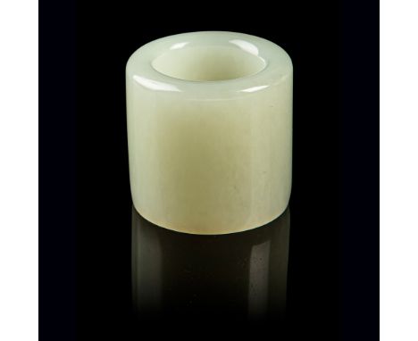 PALE CELADON JADE THUMB RING QING DYNASTY, 18TH-19TH CENTURY of cylindrical form, plain sides, the stone of even pale green c