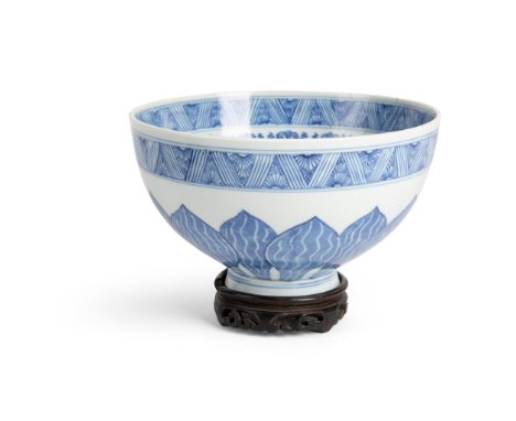 BLUE AND WHITE 'LOTUS' BOWL KANGXI PERIOD raised from a slightly everted foot to deep rounded body and wide mouth, the interi