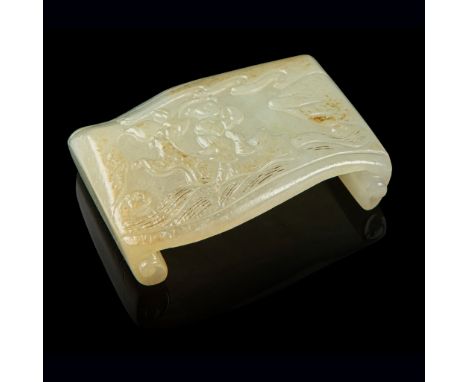 WHITE JADE 'SCROLL' INK STICK REST carved as an open scroll with the ends supporting the flattened top with undulating sides,