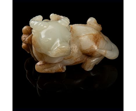 WHITE JADE WITH RUSSET SKIN CARVING OF A BUFFALO WITH BOYS QING DYNASTY, 18TH-19TH CENTURY delicately carved in round with a 