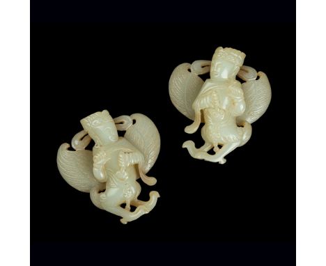 PAIR OF PALE CELADON JADE CARVINGS OF GARUDA QING DYNASTY, 18TH-19TH CENTURY finely rendered as a mirrored-image mythical cre