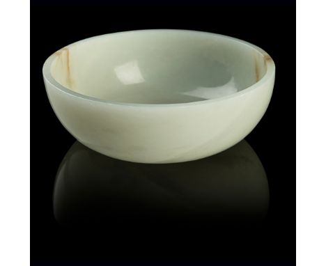 PALE CELADON JADE BOWL QING DYNASTY, 19TH CENTURY the shallow, rounded sides rising from a slightly recessed base to a straig