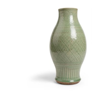 LONGQUAN CELADON-GLAZED VASE YUAN DYNASTY of ovoid form with waisted foot and neck, finely carved on the body with diamond-sh