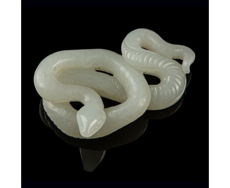 WHITE JADE CARVING OF A SNAKE QING DYNASTY, 19TH CENTURY attractively rendered in openwork as a coiling snake, the top side o