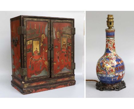 A Japanese Lacquered Table Cabinet, Meiji period, painted with figures on a red ground, together with a Chinese porcelain bot