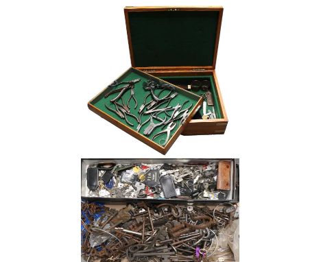 A Large Quantity of Keys, various padlocks, pliers, punches and tools, some in an oak canteen.