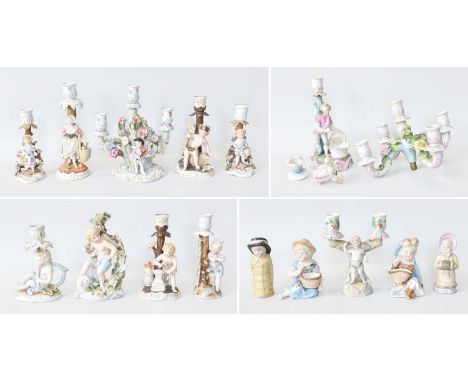 Two Trays of Various German Porcelain Flower Encrusted Candlestick Figures, together with a pair of German porcelain pepperet