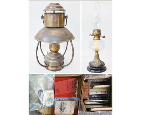 A Brass Hanging Oil Lamp, an oil lamp with clear glass reservoir, a small quantity of postcards, cigarette card and various b
