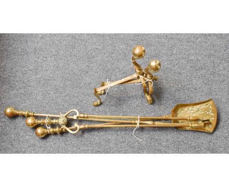 A Set of Three Brass Fire Tools and a Pair of Hand Irons, in the Art Nouveau taste.