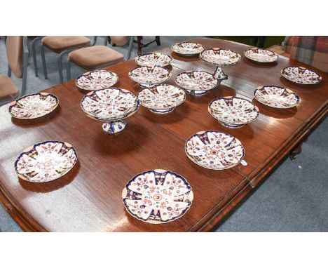 A Victorian Ashworth Pottery Dessert Service, painted in the Imari style, comprising six various comports, and twelve plates 