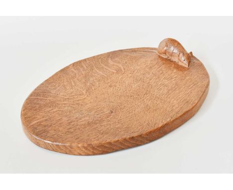 Robert Mouseman Thompson (1876-1955): An English Oak Cheese Board, of standard form, with carved mouse trademark on the board