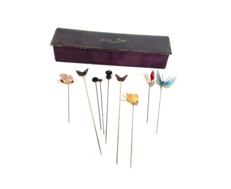 Selection of vintage butterfly and other hat pins together with hat box box 