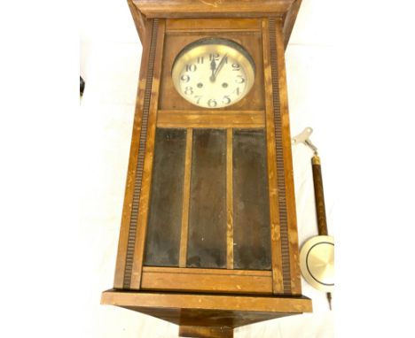 Edwardian oak wall clock, with pendulum and key 