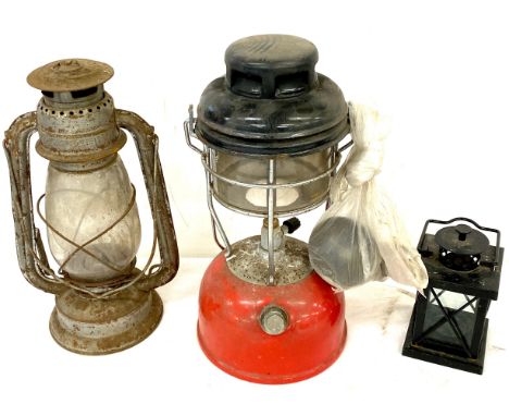 3 Vintage and later lamps to include a tilley lamp, hurricane lamp etc 