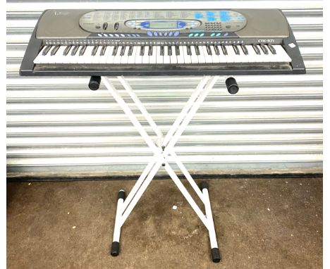 Casio keyboard on stand, model number CTK_571, working order 