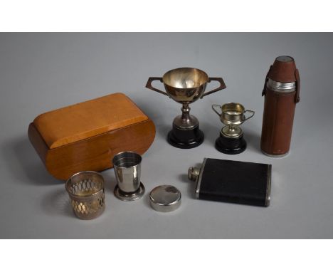 A Collection of Sundries to include Leather Cased Flask and Four Drinking Tots, Two Trophies, Hip Flask, Musical Cigarette Bo