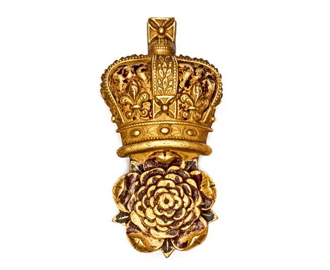 A Georgian Grenadier Guards officer’s gilt bearskin badge, crowned rose, with long wire loop fastener, 4½” x 2¼”. Good Condit