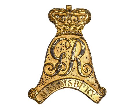 An officer’s gilt badge for Tarleton helmet of the Malmesbury Troop, Wiltshire Yeomanry, die struck, of “helmet” form bearing
