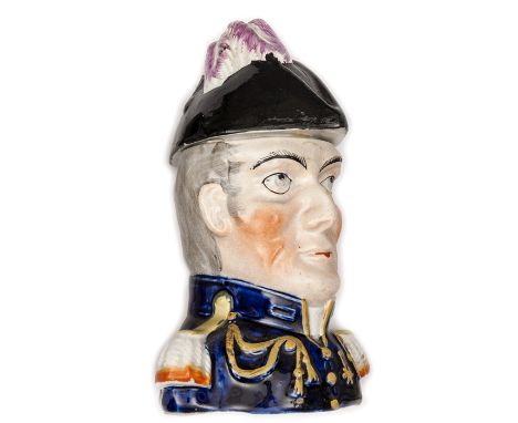 A Staffordshire polychrome lidded jar in the form of a bust of Wellington, wearing blue coat and epualettes, his cocked hat f