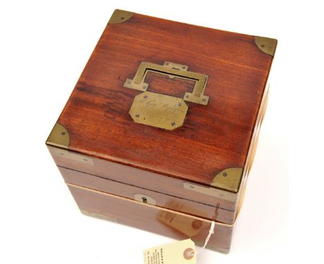 A good quality Georgian brass bound mahogany box for 4 glass spirit decanters, 8” x 8” x 7” high, the lid with folding recess