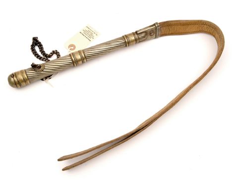 An Eastern European (?) riding crop or whip, the spiral handle and mouth of white metal with bands of pale brass, and with wh