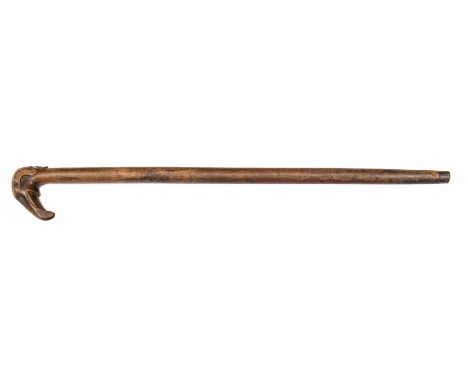 A late 19th century Greek wooden walking stick, 37” overall, the handle carved with a stylised elephant’s head, mask of a bea