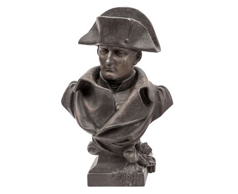 A blackened spelter bust of Napoleon, wearing bicorne hat and cloak, integral square base with riband, signed “Noel R 1894”, 