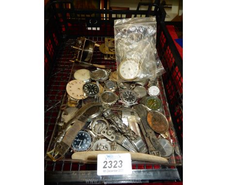 A quantity of old watch faces, clock works, straps etc.