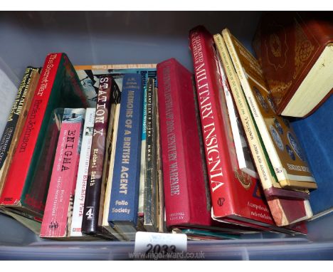 A box of books on Warfare, Buttons of The British Army, Enigma etc.