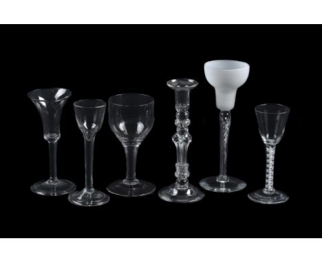 An assortment of glass, various dates, comprising: three plain stemmed wine glasses and an opaque twist wine glass, and a can