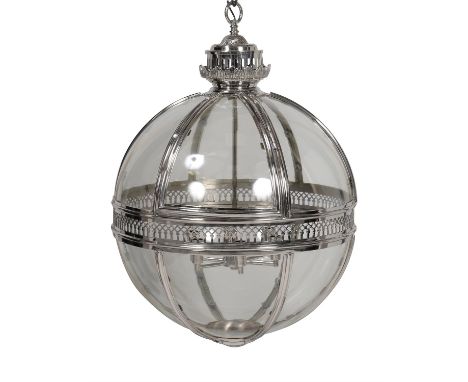 A nickel plated metal and glazed 'globe' lantern or porch light, modern, the segmented globular body with central pierced ban