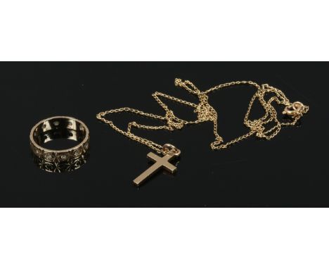 A 9ct gold ring along with a 9ct gold cross on yellow metal chain.