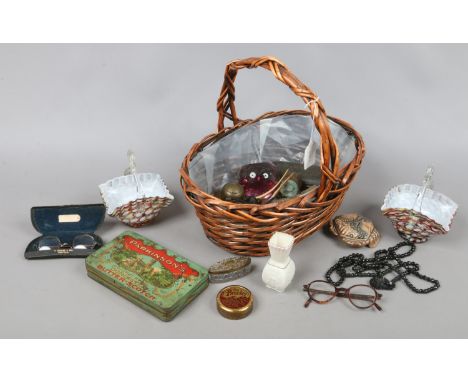 A basket of collectables to include Belleek miniature vase, Wade, Caithness paperweight, various inkwell, trinket boxes, Fren