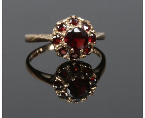 A 9ct gold garnet cluster ring, size I 1/2.