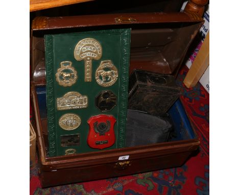 A painted tin trunk, fire guard, tin deed box, farming related brass badges etc.