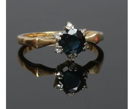 A mid 20th century 18ct gold solitaire sapphire ring set with diamond points, size I.
