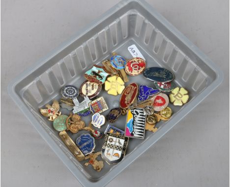 A collection of mostly enamel badges to include railway, bowling, girl guides etc.