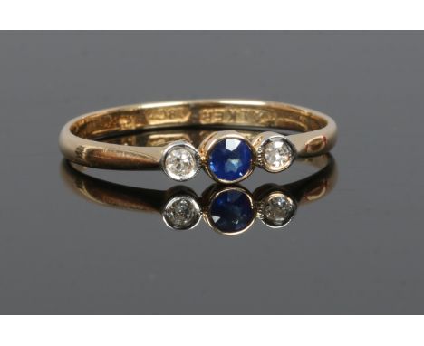 An 18ct gold sapphire and diamond ring with rub over setting, size O.
