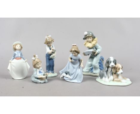 Six Nao porcelain figures including a young boy playing an accordian a girl holding a doll etc.