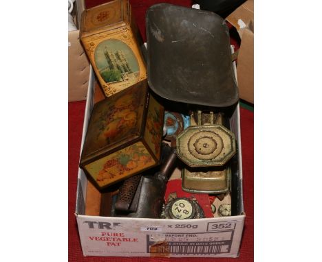 A box of vintage metalwares and tools including set of kitchen scales and tins.
