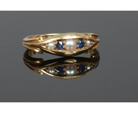 An early 20th century 18ct gold sapphire and pearl ring in boat shaped setting, size I.