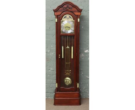 A reproduction longcase clock with two train springer movement and with a brass arch top dial, signed C. Wood & Son.